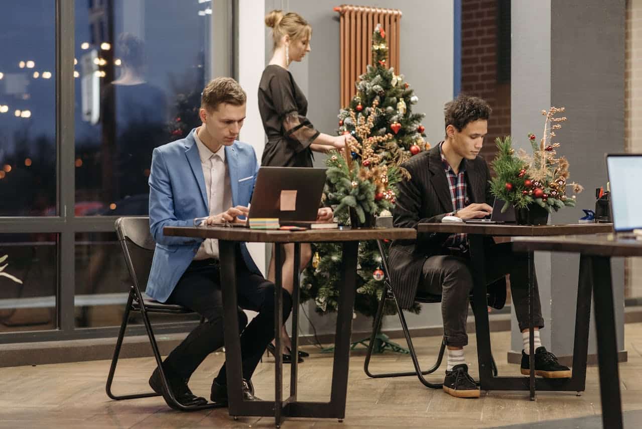 Photo of Men Working on Their Laptops